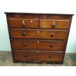 A late Georgian mahogany and oak cross banded chest of 2 short and 3 long graduated drawers with