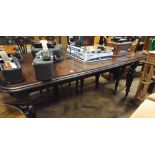 A reproduction Victorian style mahogany extending dining table with centre leaf