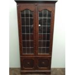 1920's oak leaded book case fitted 2 glazed doors with cupboard doors under 178cms tall,