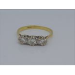 A 3 stone diamond ring in an older style illusion setting 18ct gold shank ring size N