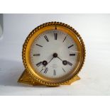 19th century gilt metal cased striking clock white enamel dial signed M Mott Cheapside London