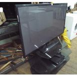 A 50" Samsung digital LCD television with Freeview and a 3 tier black glass stand