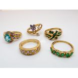 Five ladies 9ct yellow gold multi gem set rings to include tanzanite and synthetic emerald - sizes