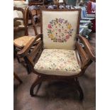 Oak framed elbow chair with tapestry upholstered seat and back