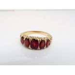 9ct yellow gold 5 stone garnet half hoop ring in a carved style setting ring size R