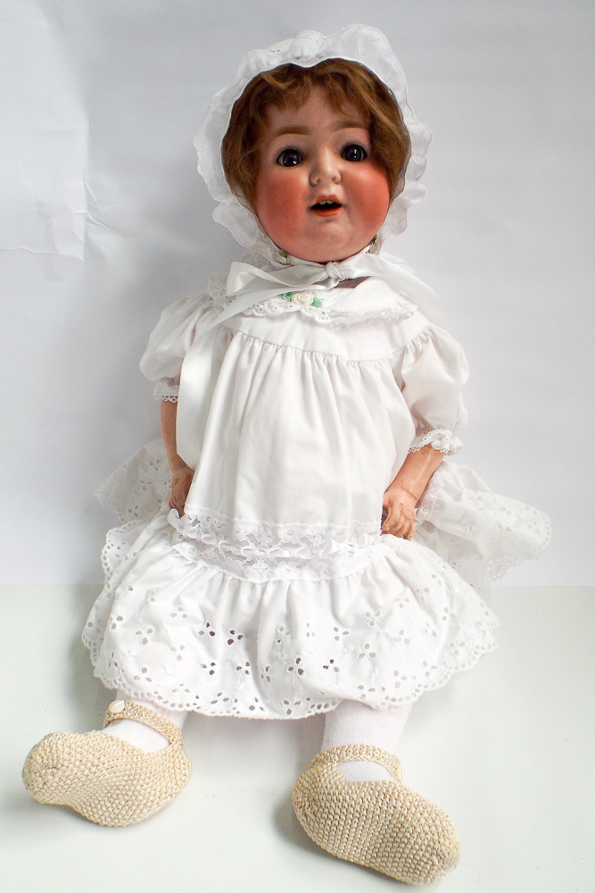 German bisque head doll, head inscribed Burggrub numbered 169-7 Germany composition jointed body.
