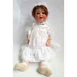 German bisque head doll, head inscribed Burggrub numbered 169-7 Germany composition jointed body.