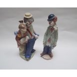 Two Lladro figures one of a clown couple holding lambs, the other a clown holding a violin,