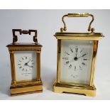 A miniature carriage clock by Matthew Norman of London 9cms high and another modern carriage clock