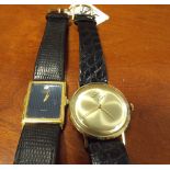 A gent's Raymond Weil quartz wrist watch and a 14ct gold cased gent's wrist watch both on black