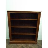 A 1920's oak book case with adjustable shelves 137cms height,