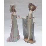 Two Lladro figurines of ladies both in flowing dresses and hats - approx 15" tall