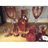 A collection of cranberry glass,