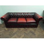 An antiqued red leather buttoned Chesterfield 3 seater sofa measurements are 188cms long,