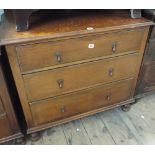 An oak chest of 3 long drawers