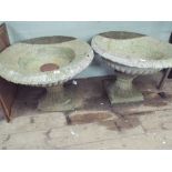 A pair of large urn shaped concrete garden planters 28" across,