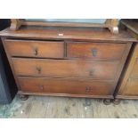 A oak chest of 2 long and 2 short drawers