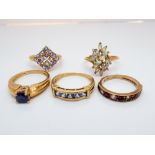 Five modern 9ct yellow gold gem set ladies dress rings to include opal and tanzanite,