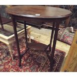 A 2 tier oval Edwardian mahogany occasional table