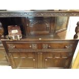 A 4'6 reproduction dark oak buffet sideboard