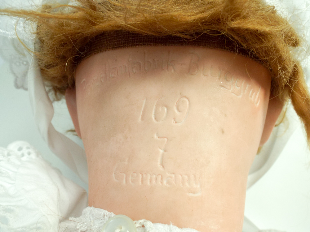 German bisque head doll, head inscribed Burggrub numbered 169-7 Germany composition jointed body. - Bild 2 aus 2