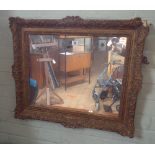 An old gilt framed mirror