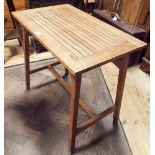 An Arts and Crafts style slatted oak table by Hughes Bolckow & Co.