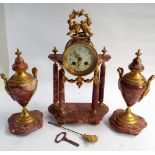 A 3 piece clock garniture in rough marble with gilt decorative mounts