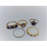 Five ladies rings to include an 18ct gold sapphire and diamond half hoop eternity ring,