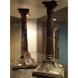 A pair of old Sheffield plated old corinthian column candle sticks