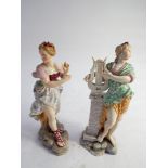 Two German porcelain figurines of scantily clad maidens.