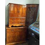 A Yew wood effect cupboard,