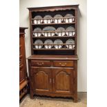 A 3'9 French oak dresser with bobbin turned shelf back,