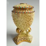 Royal China Works Worcester reticulated urn shaped vase and cover on a tri form base, numbered 307.