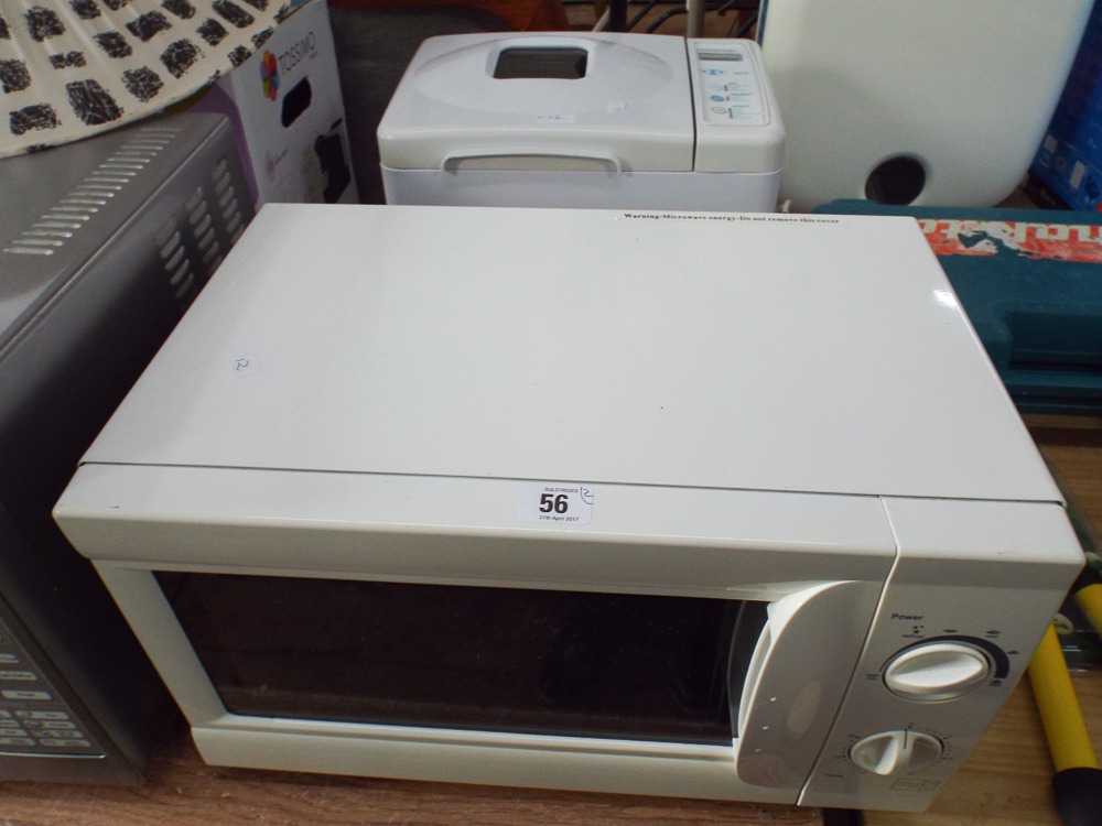 A white microwave oven and a Kenwood bread maker