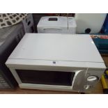 A white microwave oven and a Kenwood bread maker