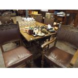 A large refectory style dining table on carved supports with set of 6 leather studded dining chairs