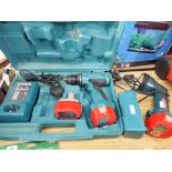 A Makita cordless drill with spare battery and charger in carrying case and a Makita torch with