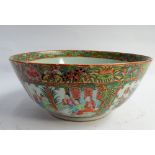 A 19th century Chinese famille rose bowl decorated with landscape scenes and birds within reserves