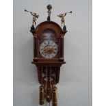 Antique style Dutch wall clock with painted arched dial depicting sailing boats with a windmill,