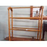 A light wood towel rail and a easel