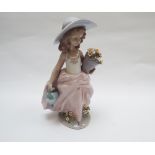 Lladro figure of a young girl in a hat holding pot of flowers and watering can - approx 9" tall