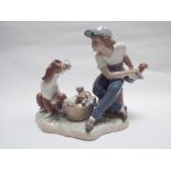 Lladro figure of a teenager with dog and basket of puppies - approximately 7" tall