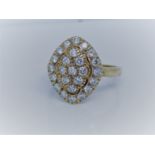 A 9ct gold diamond cluster ring set in a marquis shaped panel ring size L