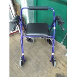 Four wheel zimmer frame with brakes and a seat