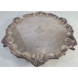 Presentation silver salver with shaped and shell cast border resting on 3 hoof feet with