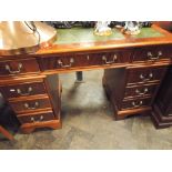 4' reproduction mahogany twin pedestal desk fitted 9 drawers with green leather top