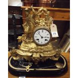 French striking mantel clock in gilt figure mounted case with stand