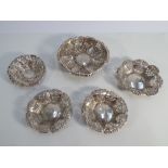 Collection of 5 Edwardian pierced silver sweet meat dishes largest measures 11cms diameter,