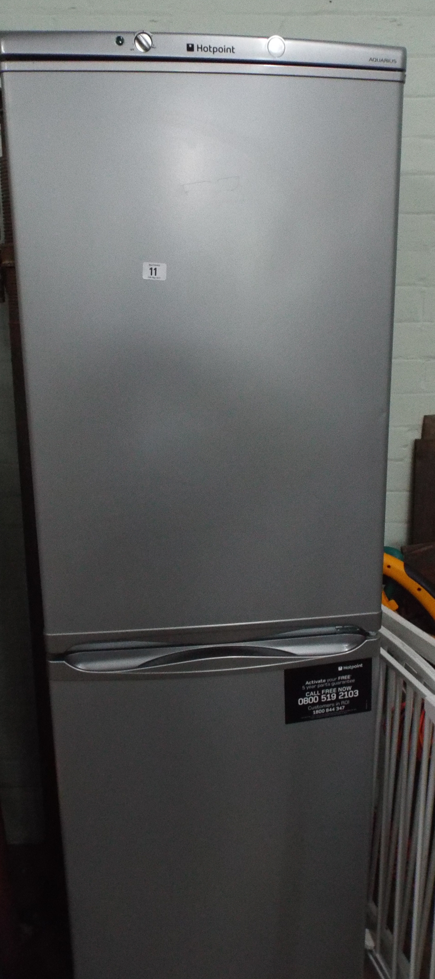 Hotpoint half and half fridge freezer in silver case